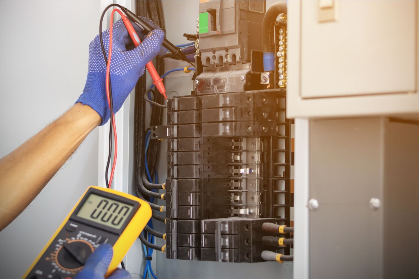 Electrician testing electrical panel in Alameda, CA